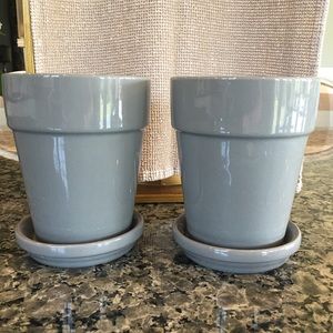 2 gray flower pots.